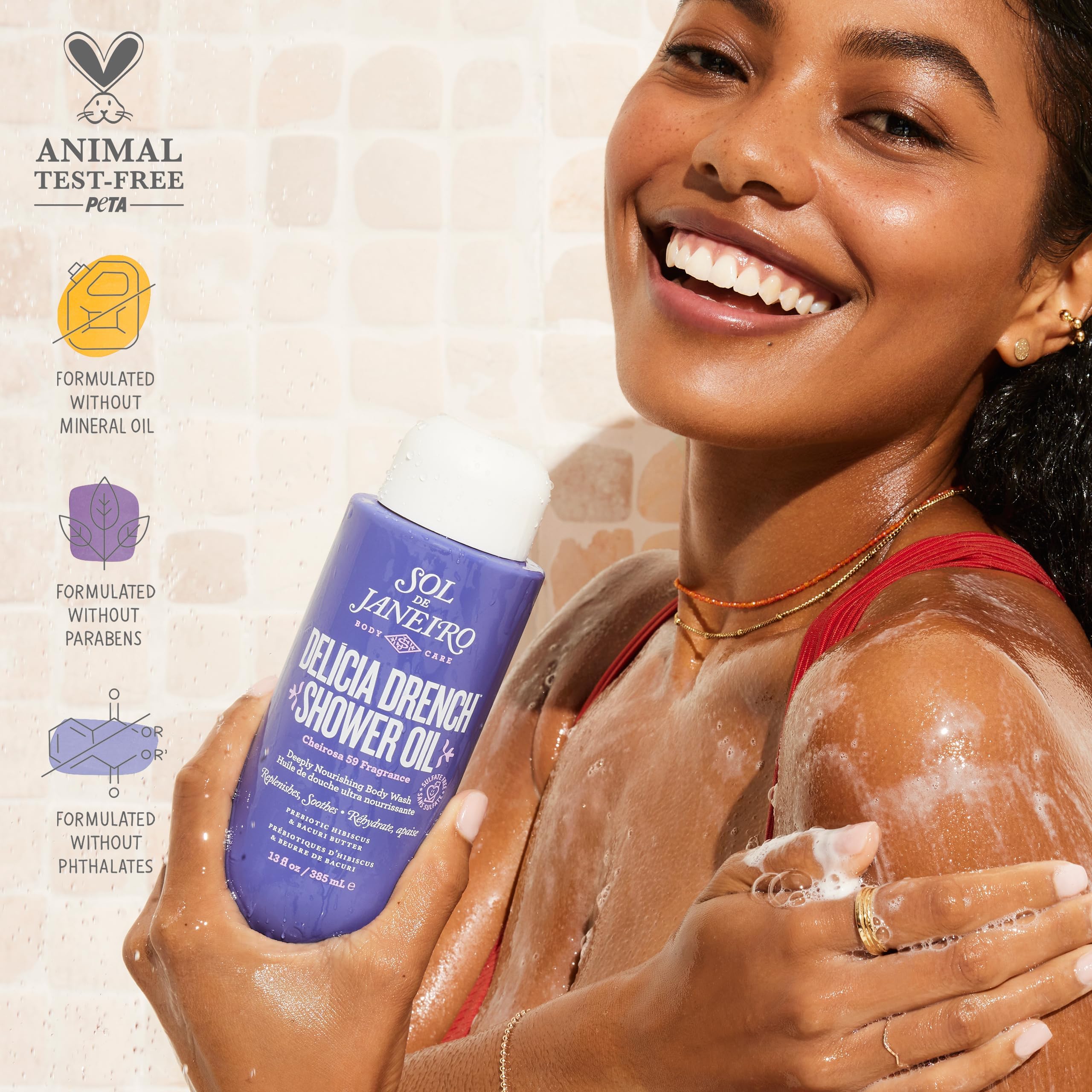 Sol de Janeiro Delicia Drench bottle on shelf suggests a spa-like shower routine.