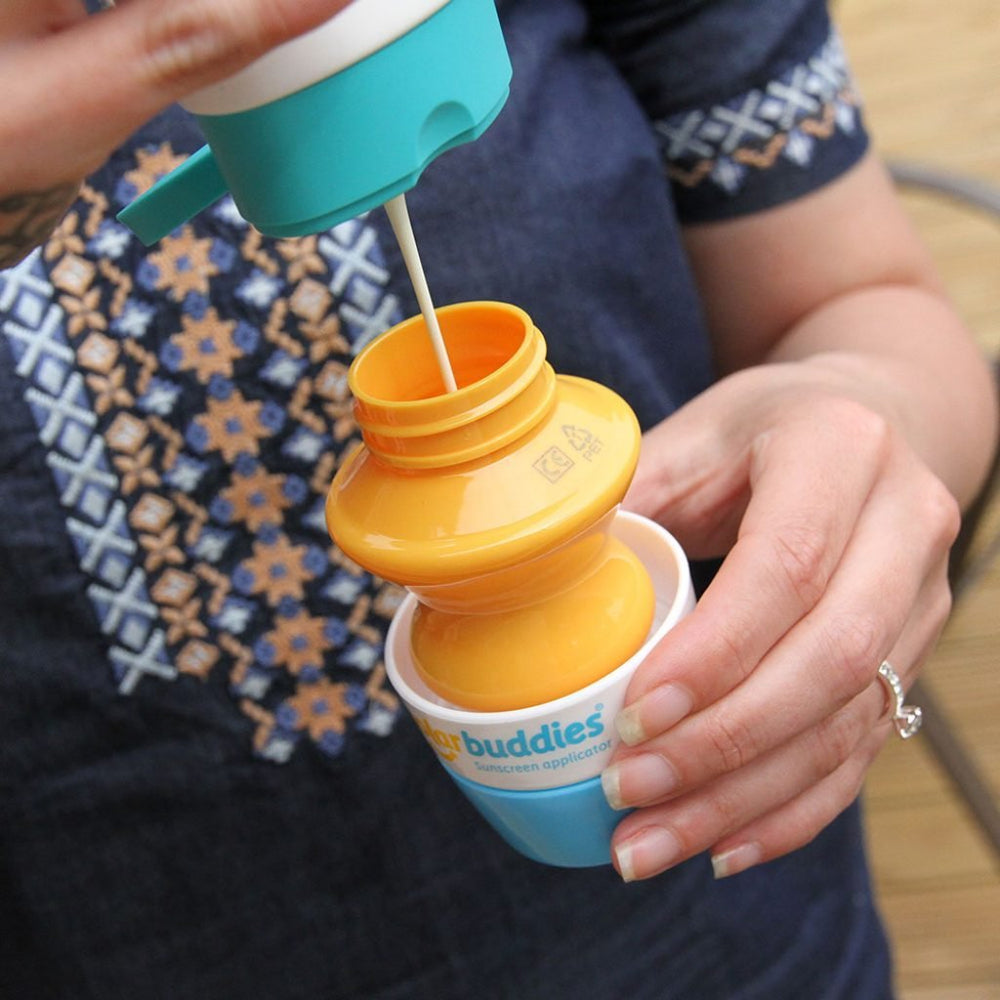 Solar Buddies refillable 3-4oz bottle blue demonstrates travel-friendly sunscreen delivery.