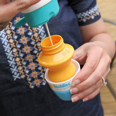 Solar Buddies refillable 3-4oz bottle blue demonstrates travel-friendly sunscreen delivery.
