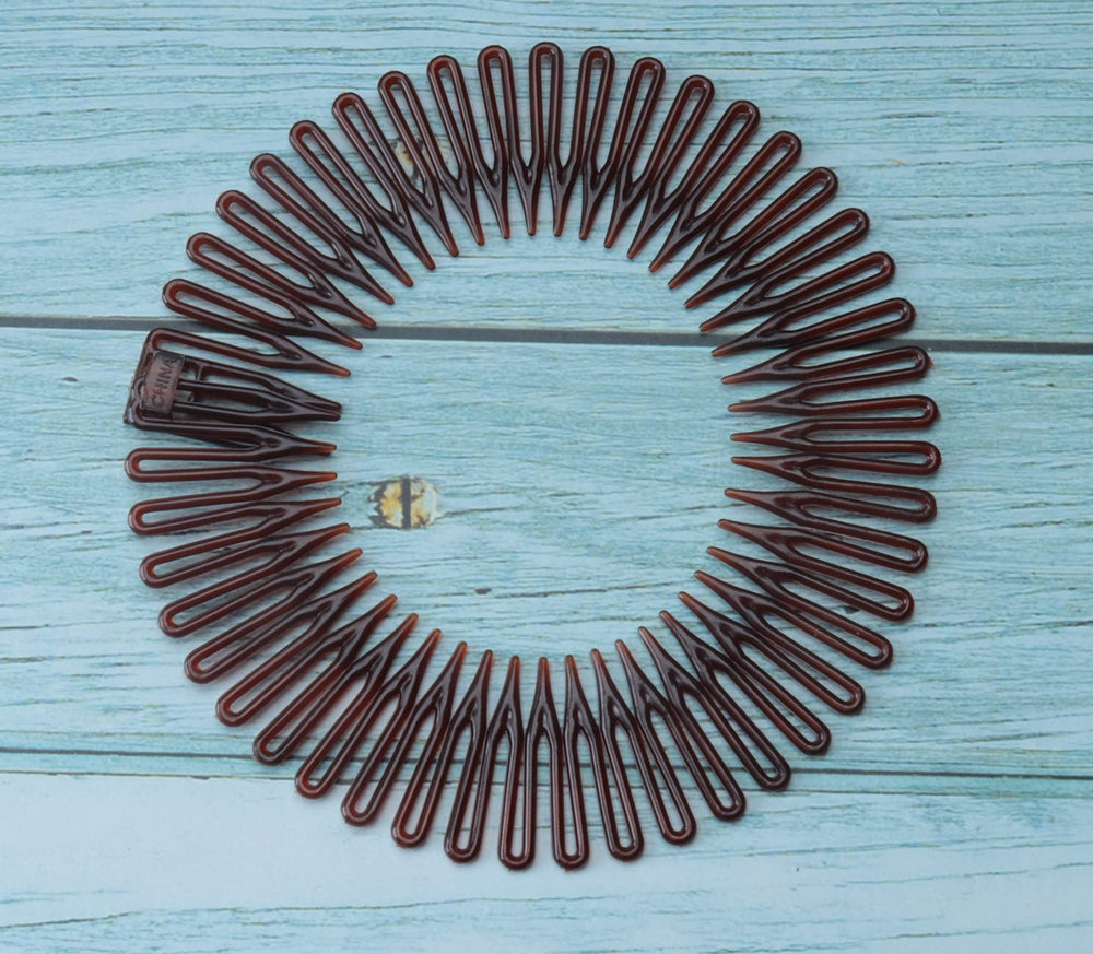 Sowaka sports-use round comb for quick hair control during workouts.