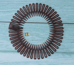 Sowaka sports-use round comb for quick hair control during workouts.