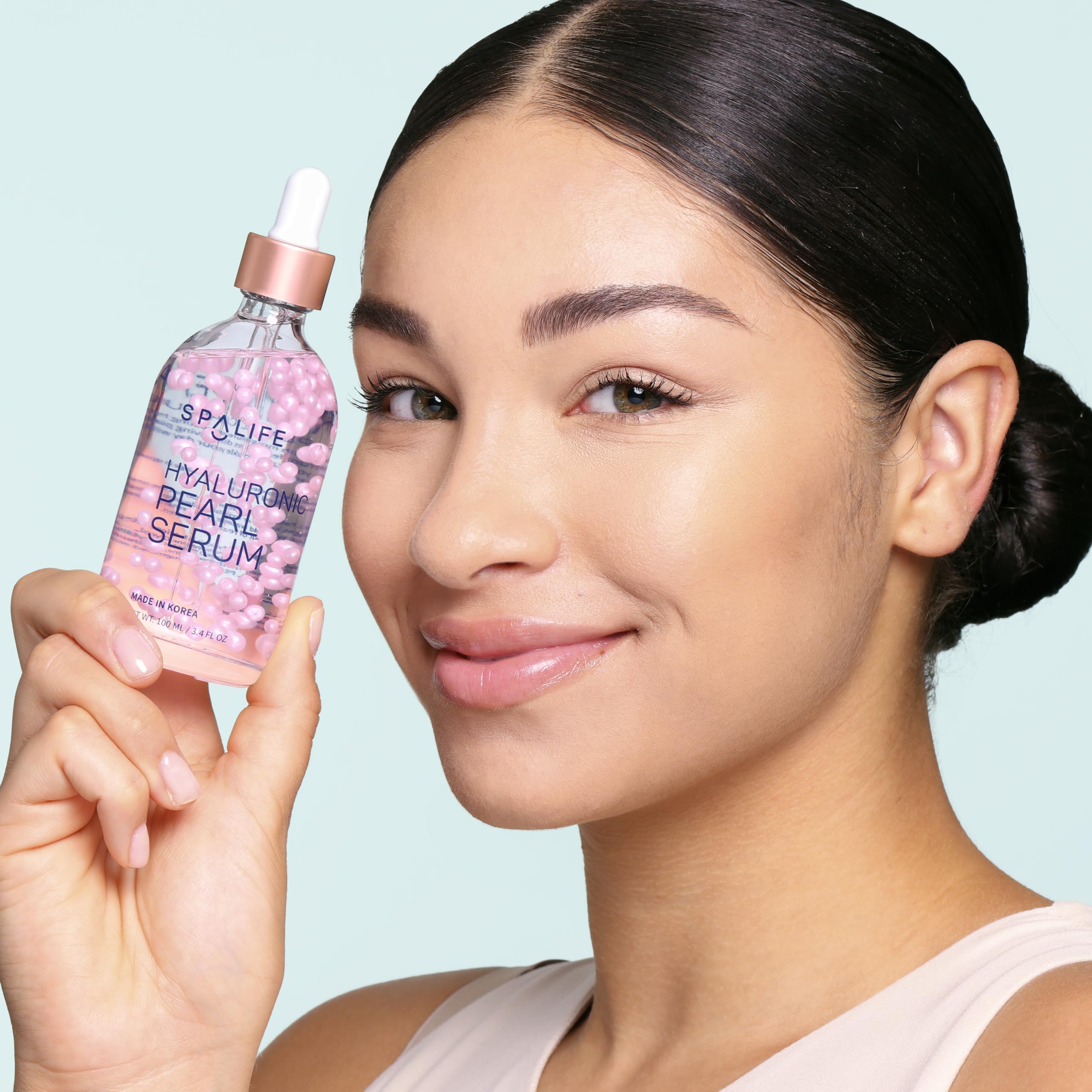 SpaLife Face Serum with visible glow and luminosity on skin