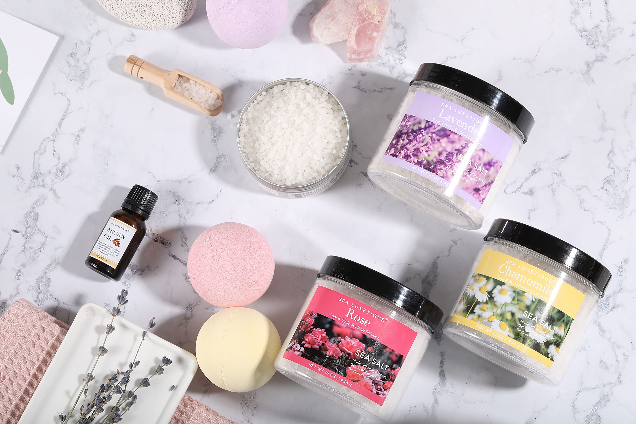 Spa Luxetique bath bombs fizzing to create a rich, moisturizing soak
