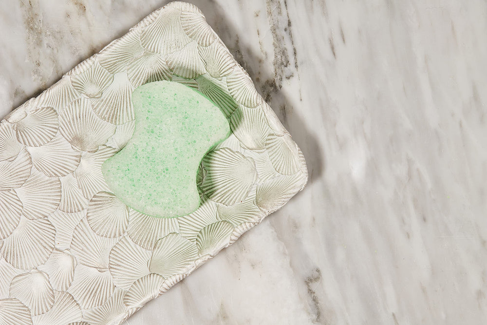 Spongeables Pedi Scrub Foot Sponge textured side exfoliates rough skin.