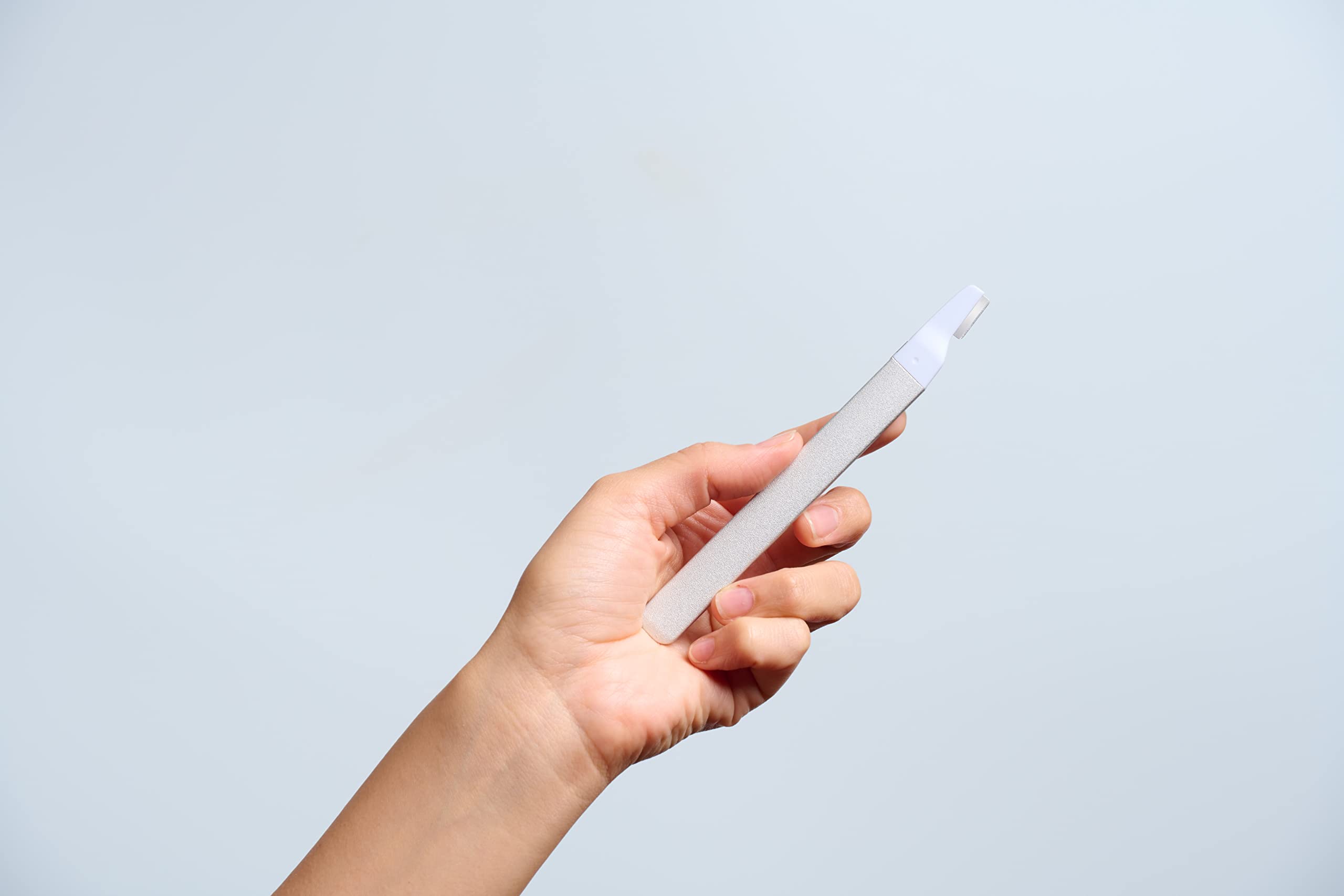 StackedSkincare travel-ready dermaplaning blades in travel case for on-the-go exfoliation.