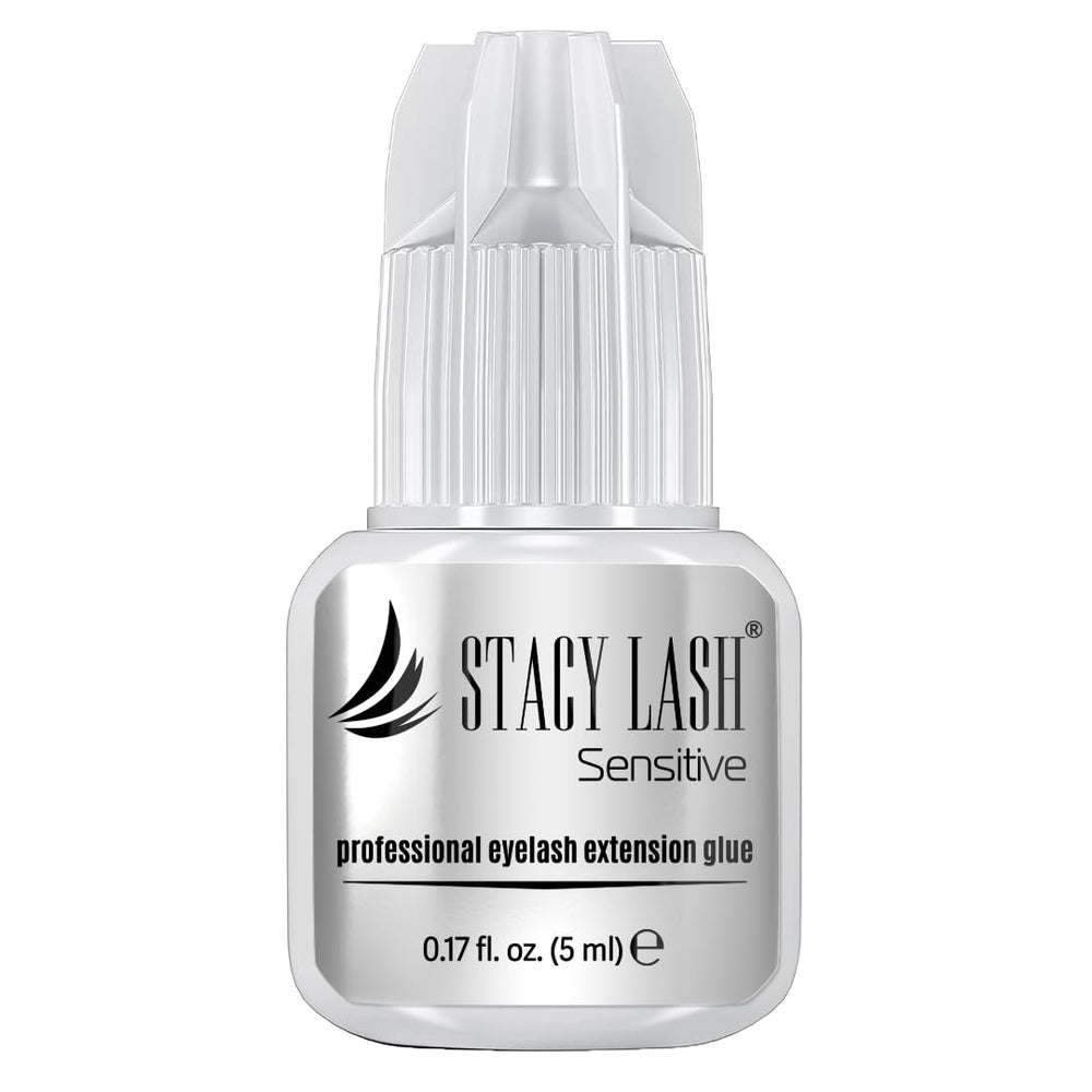 STACY LASH Sensitive adhesive bottle closeup highlighting low fumes for sensitive eyes.
