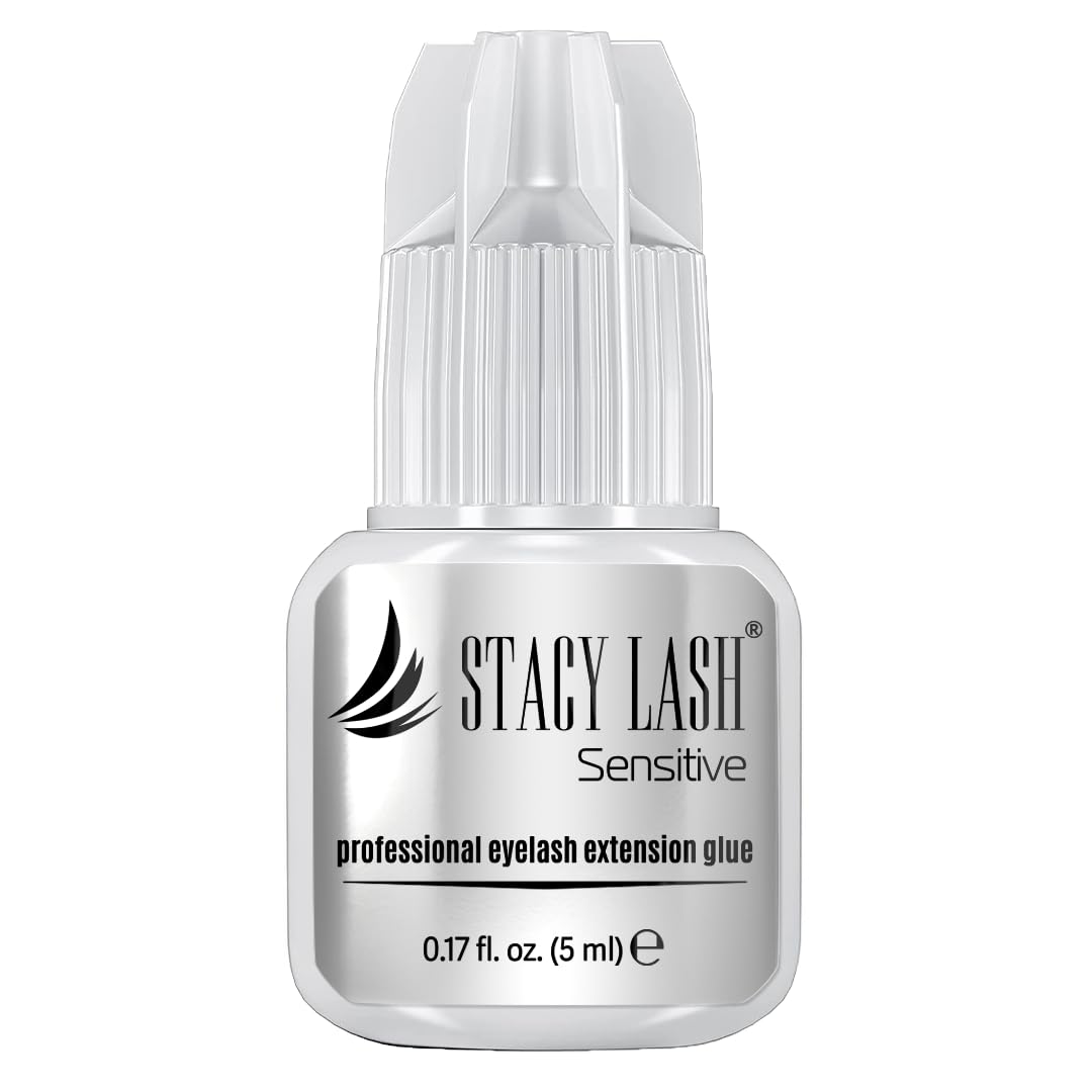 STACY LASH Sensitive adhesive bottle closeup highlighting low fumes for sensitive eyes.