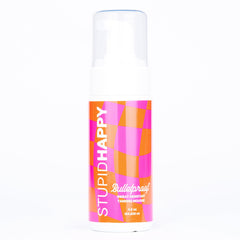 Stupid Happy self-tanner mousse bottle with even bronze glow for everyday skin.