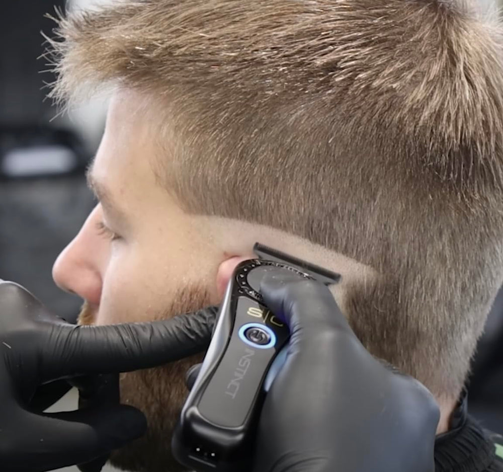 Stylecraft Instinct Pro Hair Trimmer in use showing handheld precision styling.