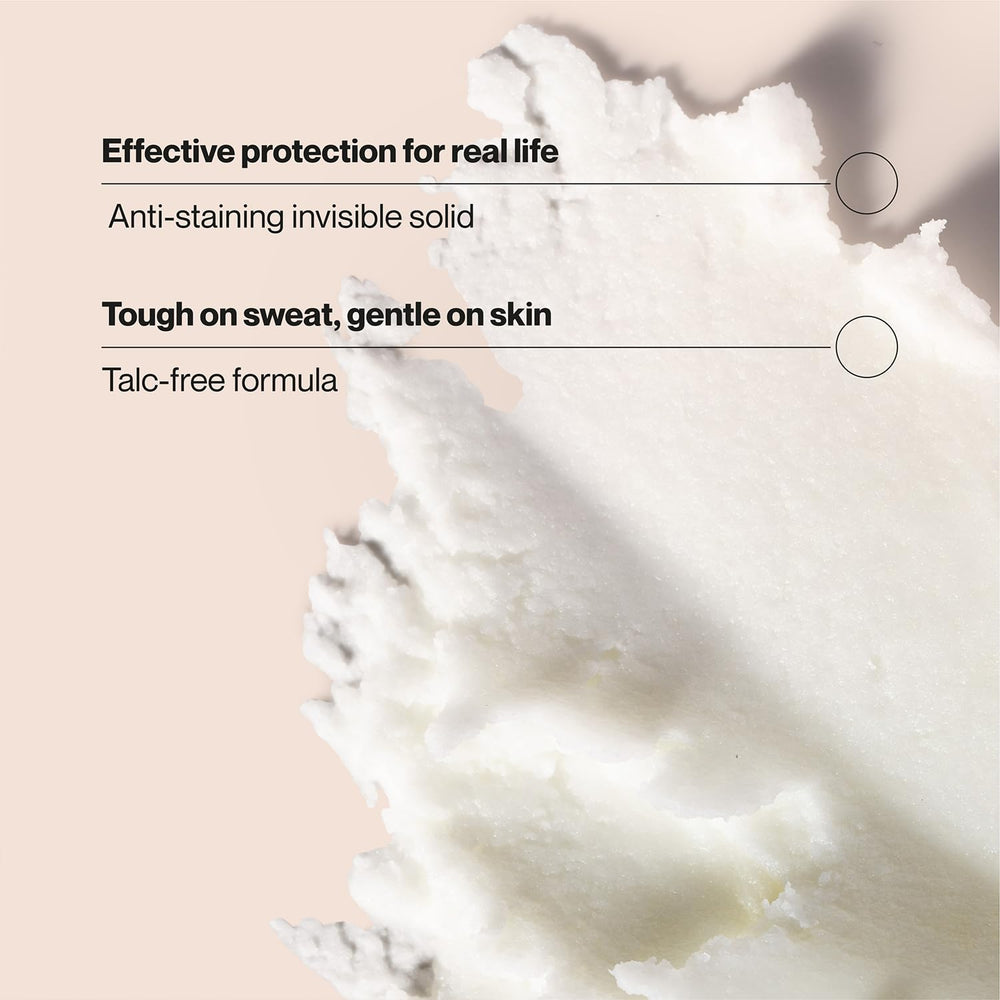 Suave Coconut Kiss underarm application demonstrates smooth glide.