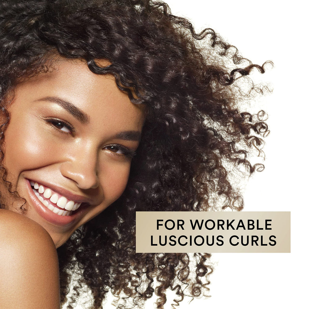 Suave Luscious Curls Conditioner highlights amino acid complex for stronger hair.