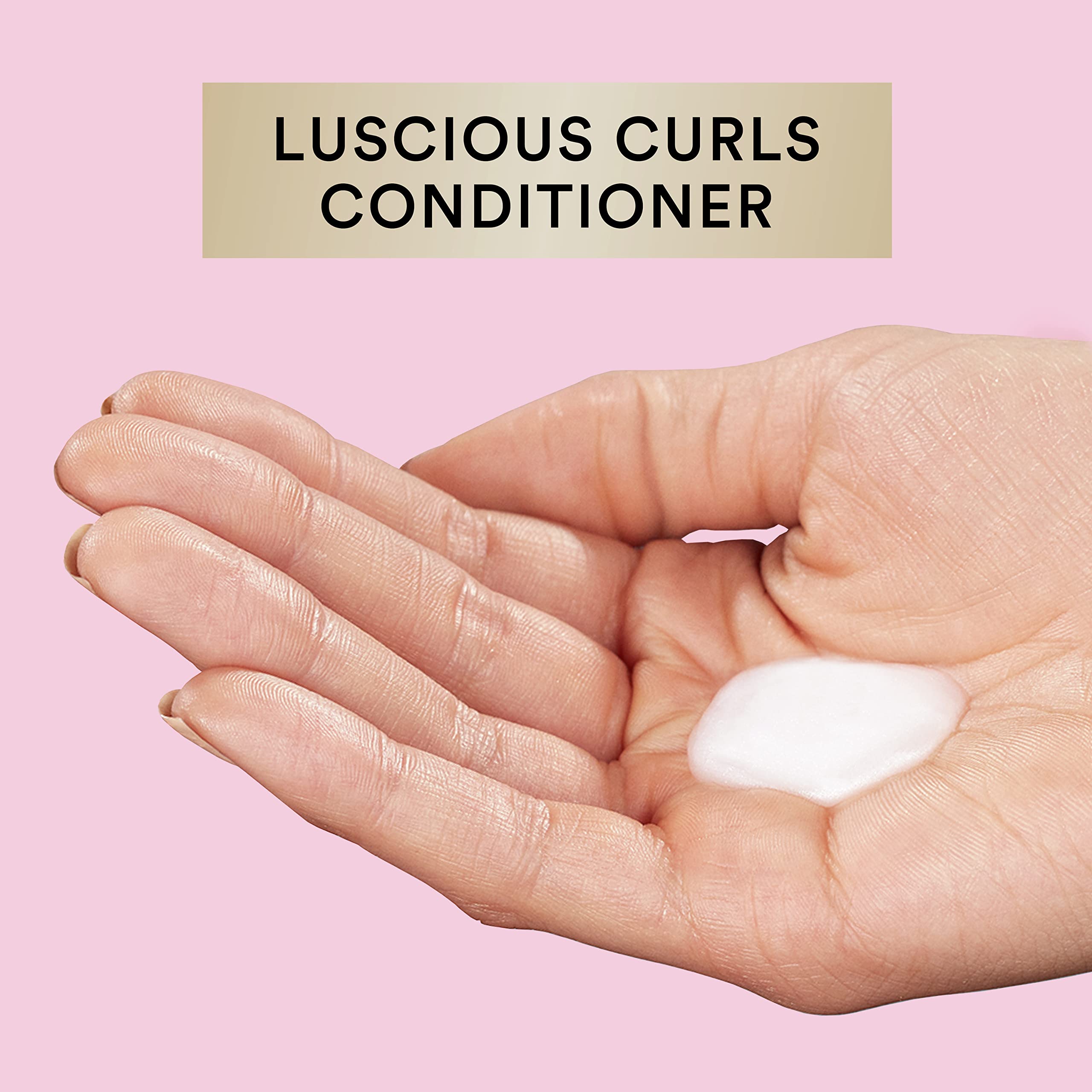 Suave Luscious Curls Conditioner creates soft, touchable curls.