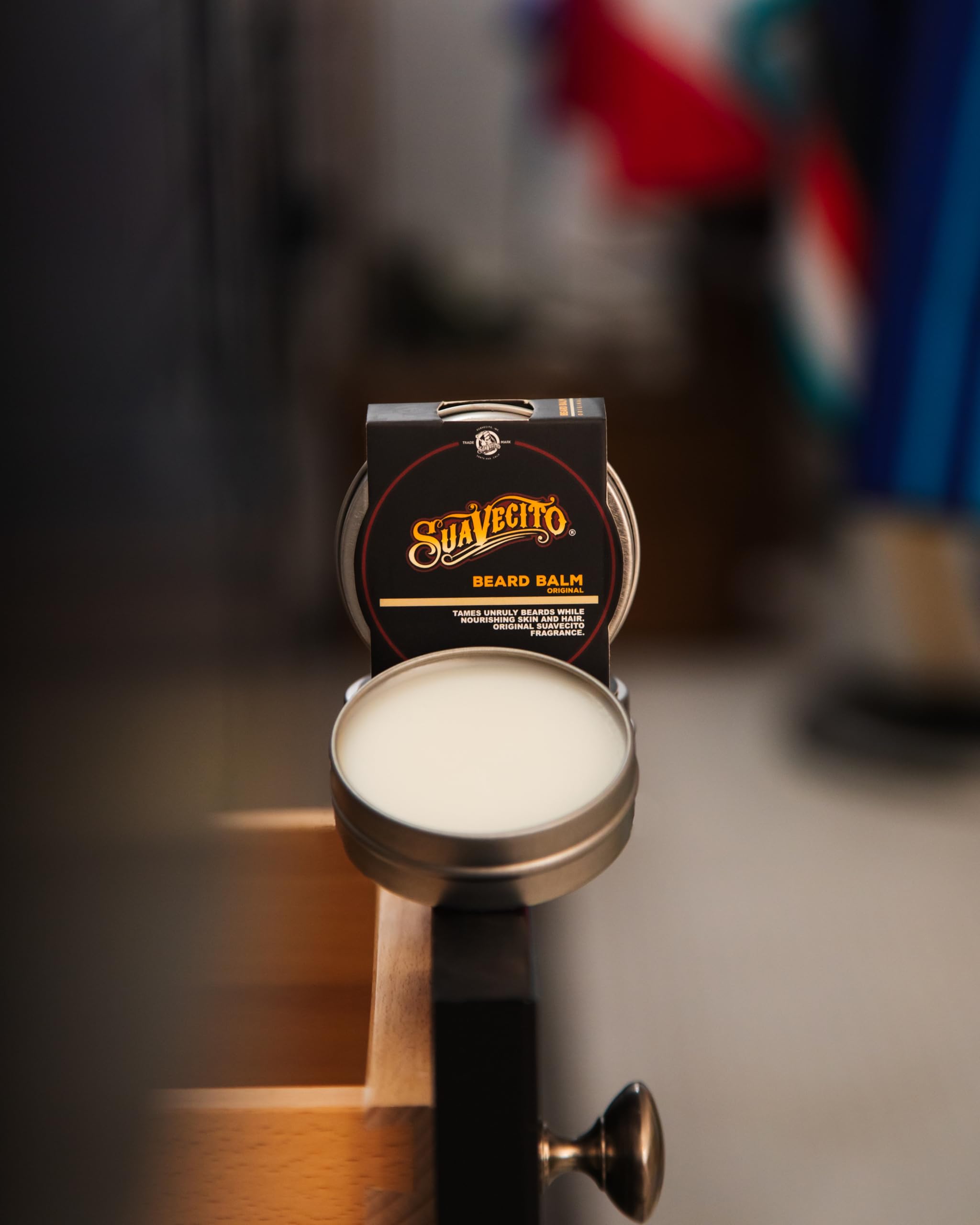 Suavecito beard balm being applied to the beard from root to tip