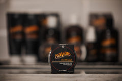 Suavecito beard balm warmed between hands for smooth application