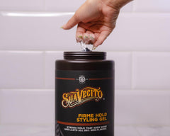 Suavecito Firme gel being applied for even distribution and long-lasting hold.