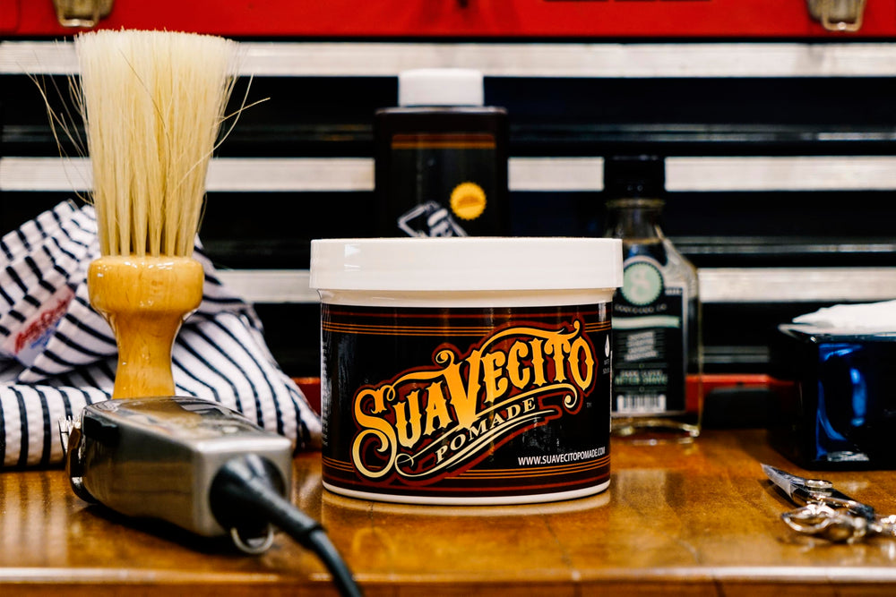 Suavecito Original Hold Pomade 32oz tub styling shot demonstrates versatile medium hold