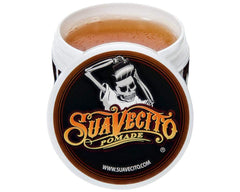 Suavecito Original Hold bottle on desk ready for daily styling and quick touch-ups.