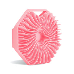 Sud Scrub antimicrobial silicone body scrubber in pink cleanses gently while reducing odor-causing microbes.