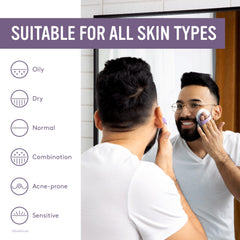 Sud Scrub face brush ergonomic finger-strap shows secure grip during cleansing.