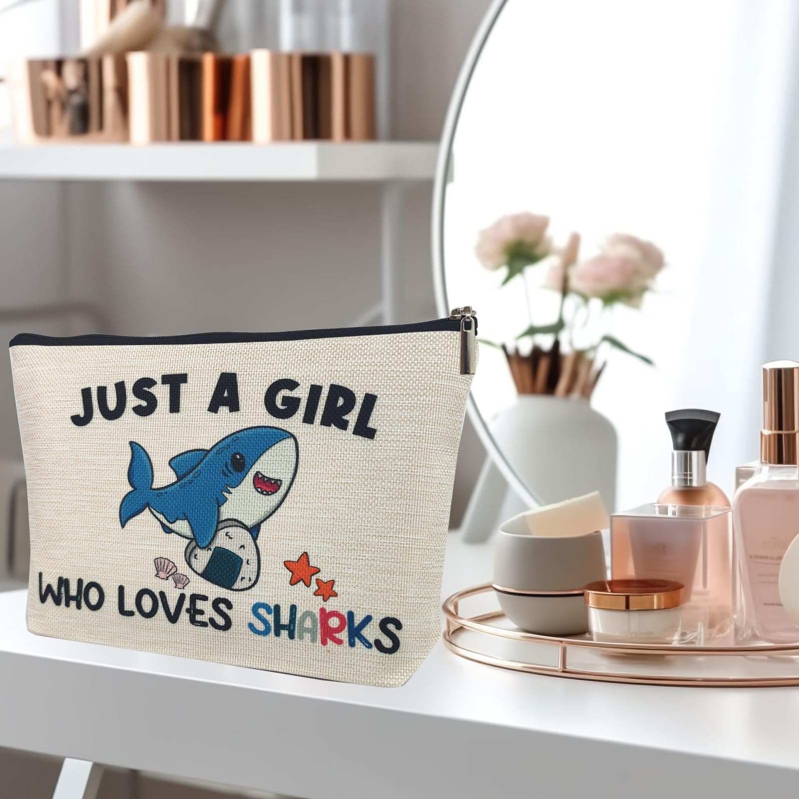 Suemetic shark gifts makeup bag with cosmetics, organized on the go.