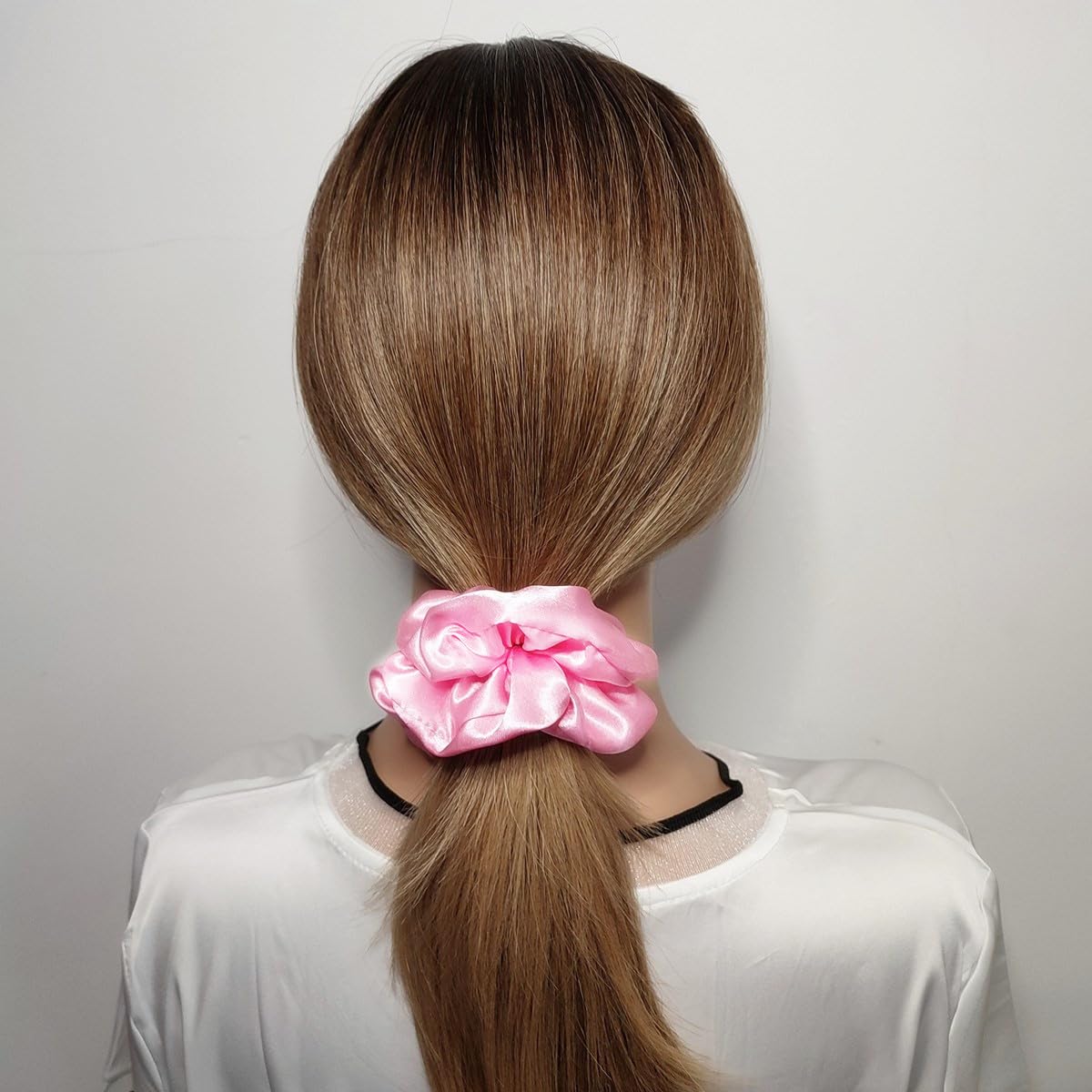 Sufermoe satin silk scrunchie worn on wrist as versatile daily accessory