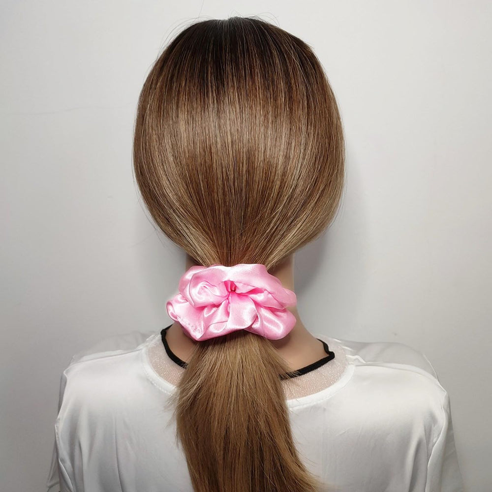 Sufermoe satin silk scrunchie worn on wrist as versatile daily accessory