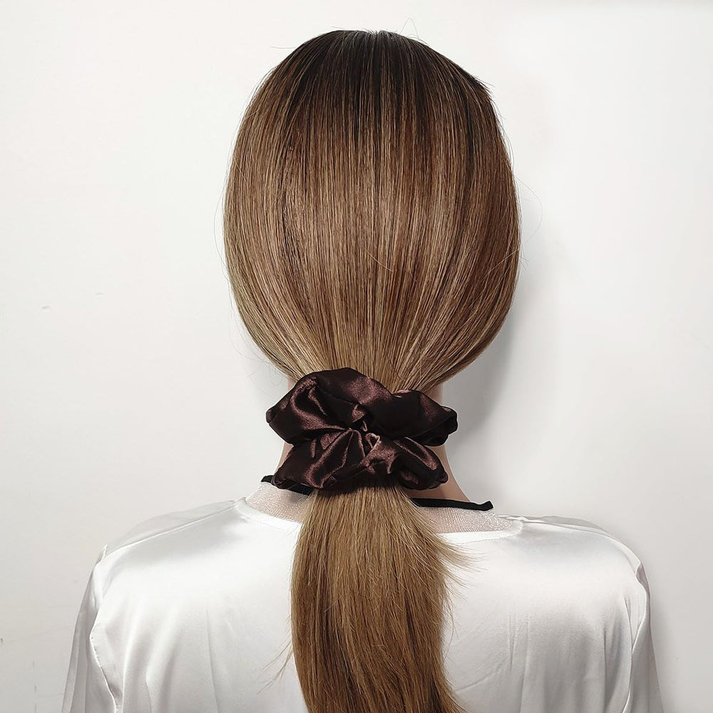 Sufermoe soft elastic satin scrunchie close-up highlighting smooth hold.