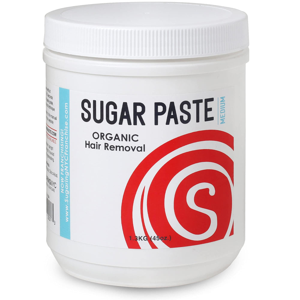 Sugaring NYC medium paste jar close-up shows organic texture for easy at-home hair removal.