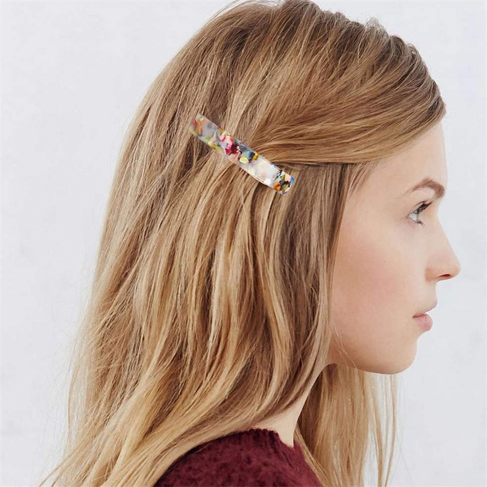 SUMAJU tortoise-shell hair clip worn in a bun shows secure, comfortable hold.