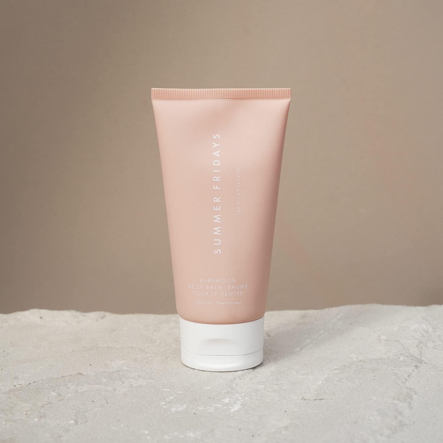 Summer Fridays Babymoon Belly Balm application demonstrates gentle, deep hydration for tired, stretched skin.