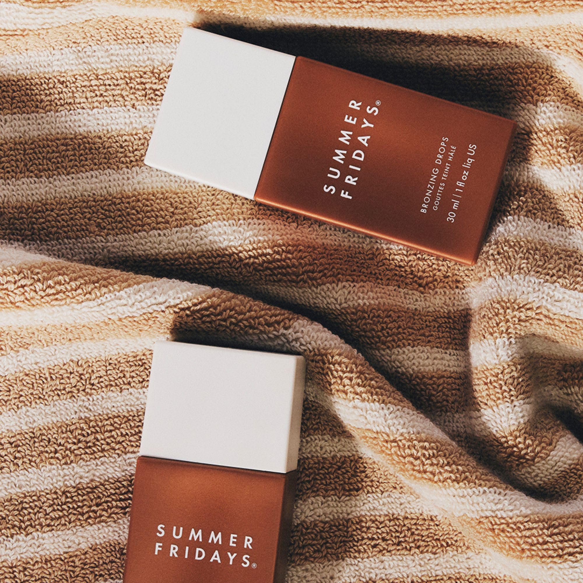 Summer Fridays Bronzing Drops on skin before makeup for a soft glow.