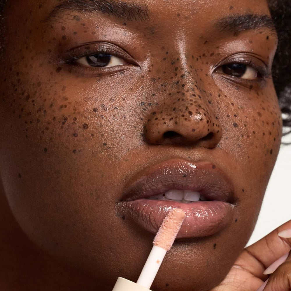 Summer Fridays Dream Lip Oil layered over lipstick adds dimension.