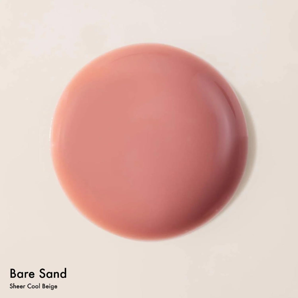 Summer Fridays Dream Lip Oil swatches on arm reveal sheer color and shine.