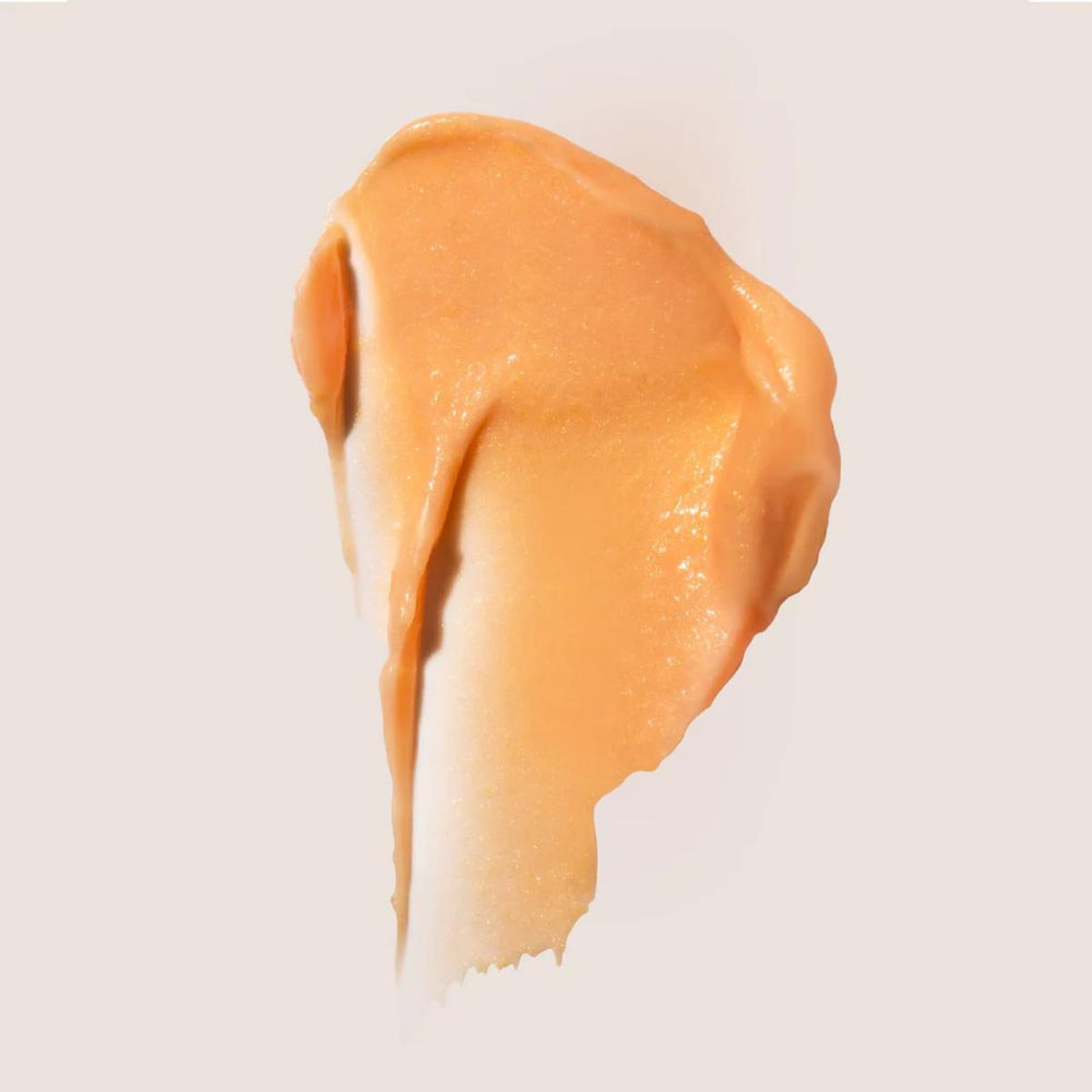 Summer Fridays Light Aura Eye Cream tube being swirled to show creamy texture.