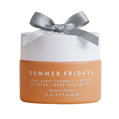 Summer Fridays Light Aura Eye Cream tube closeup for brightening under-eye skin.