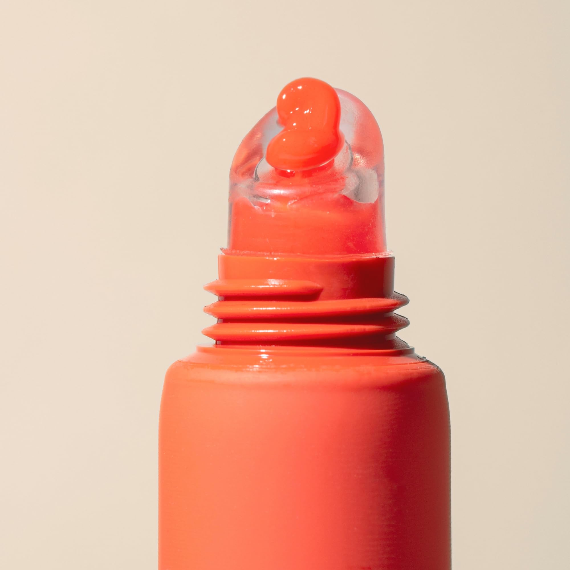 Summer Fridays Poppy swatch shows sheer coral color and hydrating feel.