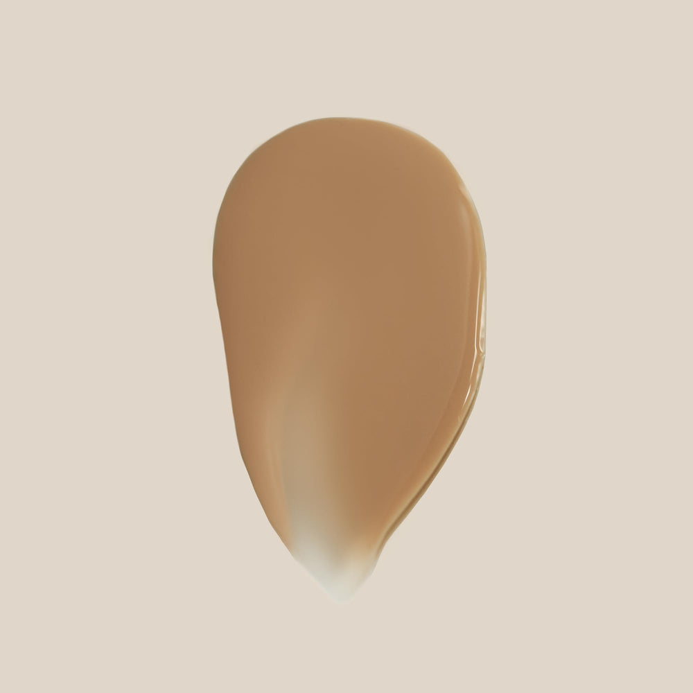 Summer Fridays Sheer Skin Tint se aplica fácilmente en el rostro para tono uniforme.