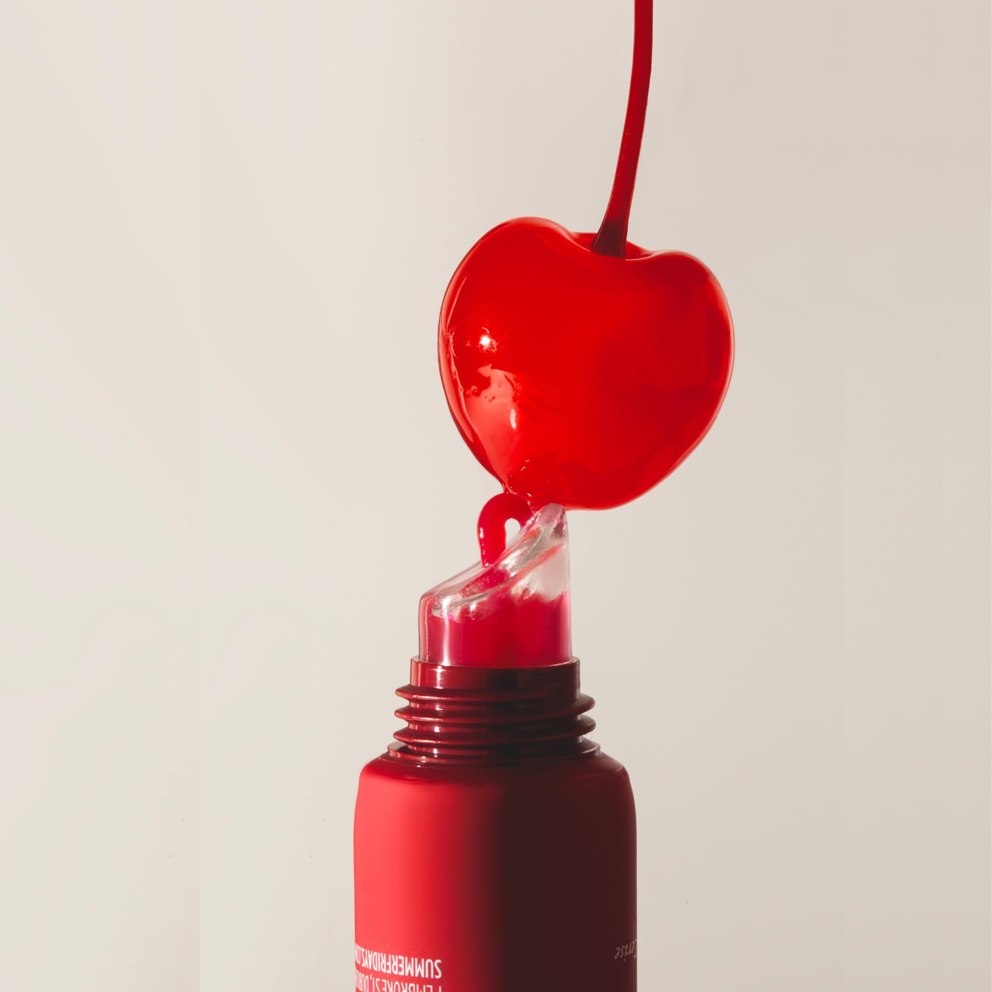 Summer Fridays Lip Butter Cherry sheer tint enhances natural lip color.