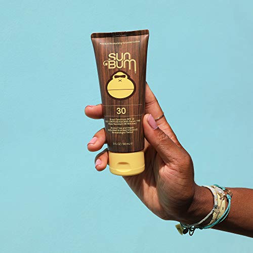 Sun Bum Original SPF 30 lotion being applied for broad spectrum coverage.