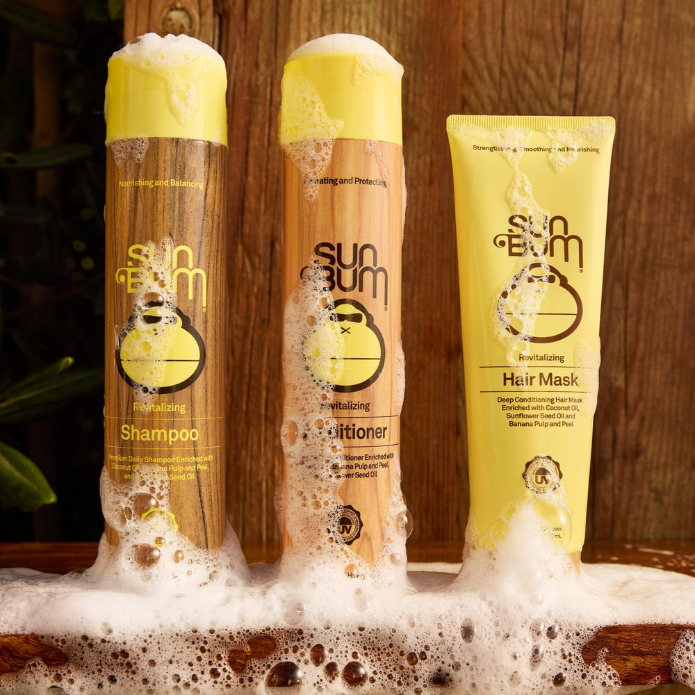 Sun Bum Revitalizing Deep Conditioning Hair Mask banana-pulp imagery signals natural conditioning.