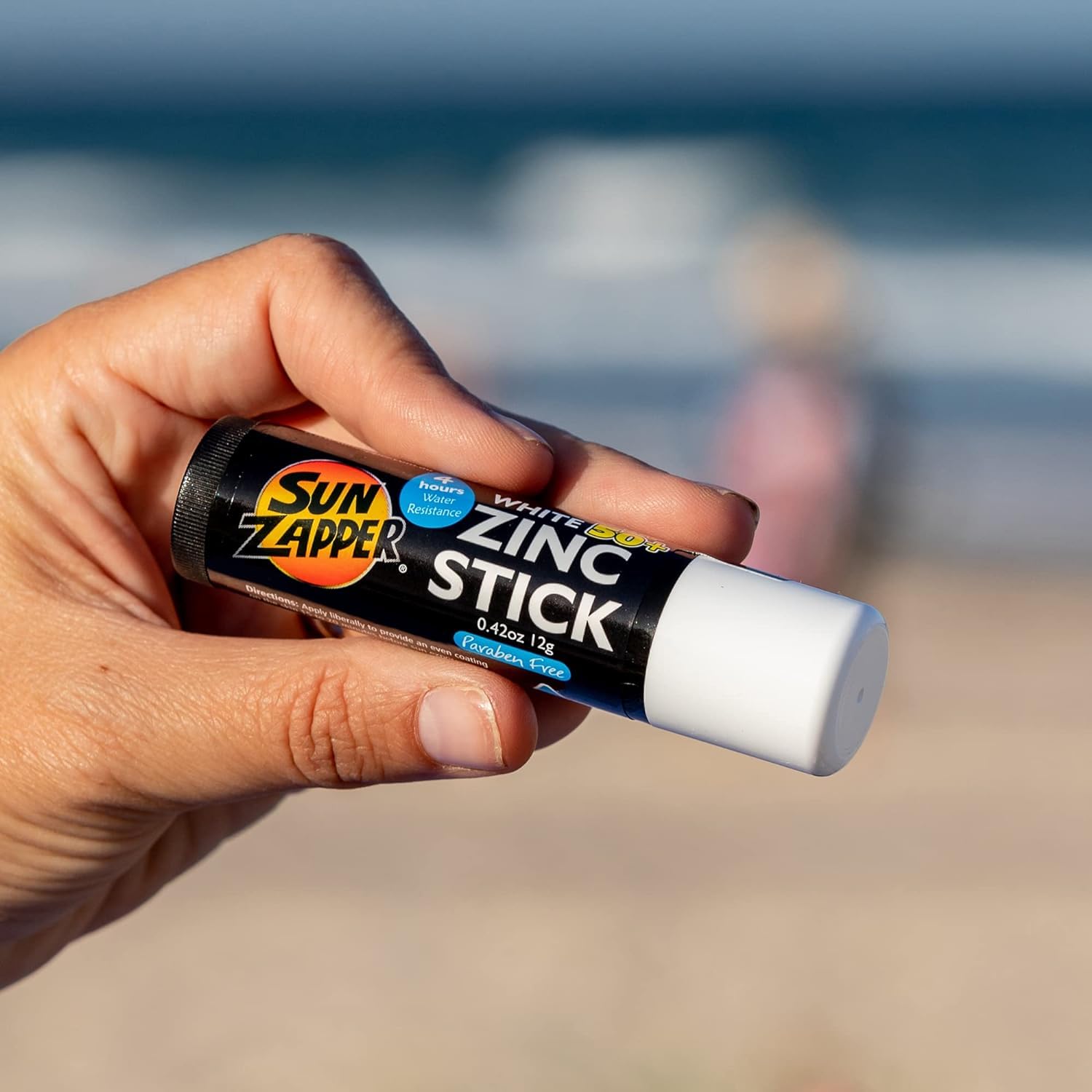 Close-up of white zinc stick highlighting natural-looking, skin-friendly finish.