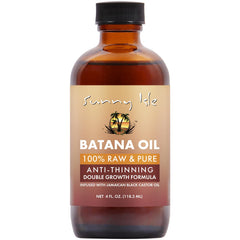 Sunny Isle Batana Oil bottle pour for easy scalp nourishment.