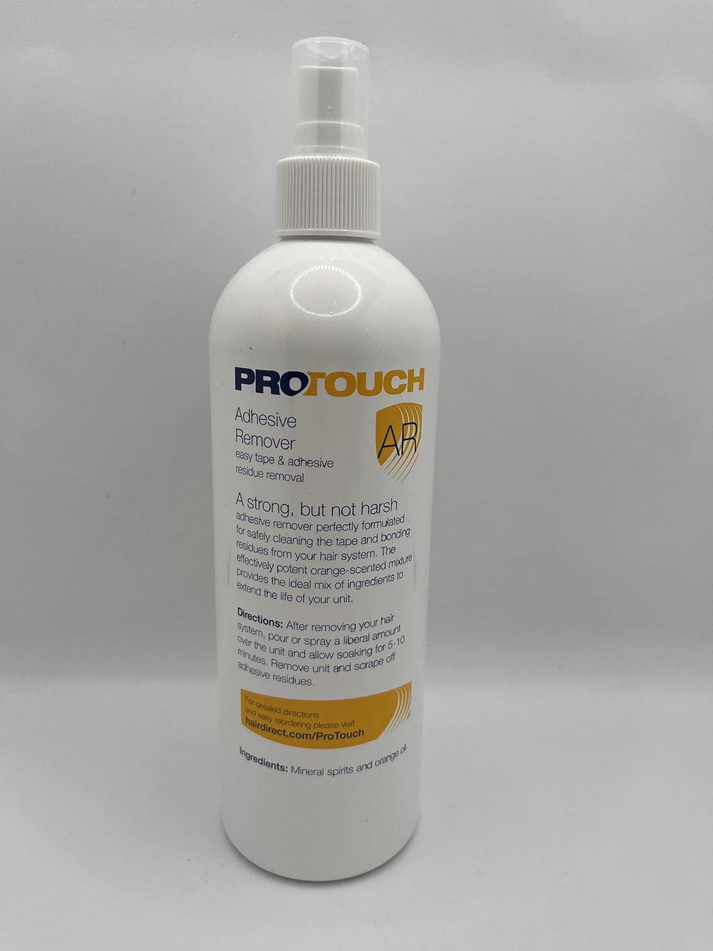 Sunshine Tape Pro Touch Adhesive Remover being applied to hairpiece for easy cleanup.