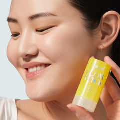 Glow Stick on the face demonstrating seamless, mess-free SPF application.