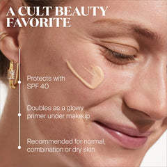 Supergoop! Glowscreen application closeup creates a dewy, makeup-ready base.