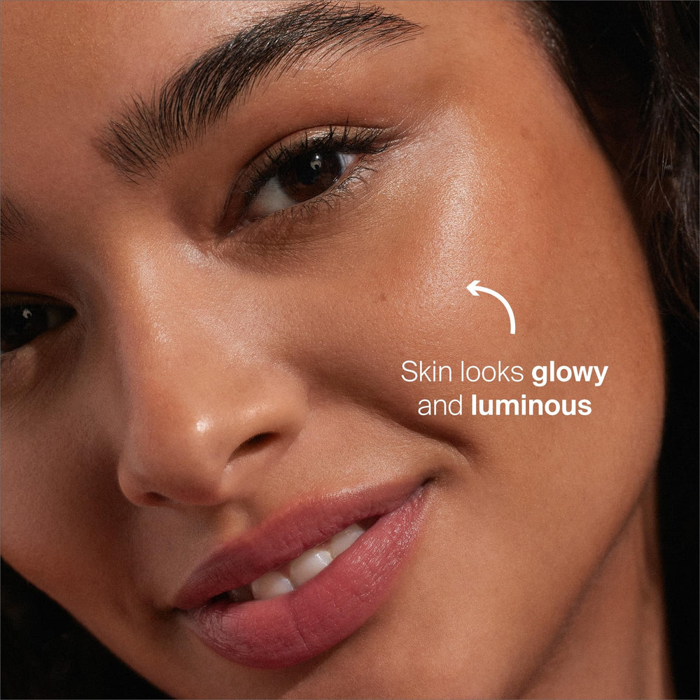 Creamy texture on finger suggesting easy glide and hydration for the skin