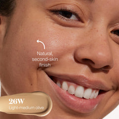 Supergoop Protec(tint) application shows seamless blending with fingers for natural finish