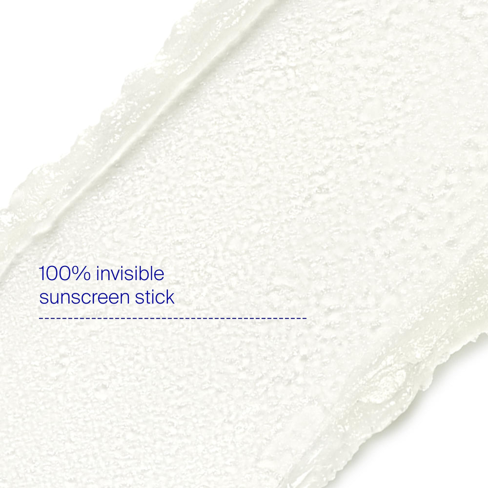 Hand applying Supergoop Unseen Sunscreen Stick for quick protection