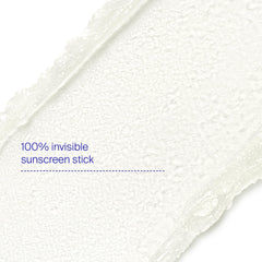 Hand applying Supergoop Unseen Sunscreen Stick for quick protection