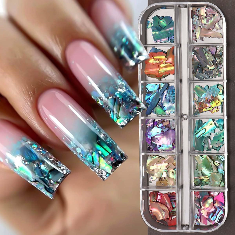 SUTOZMIWE Aurora Shell Glitter Flakes on-natural-nail create beachy iridescence in everyday manicures.